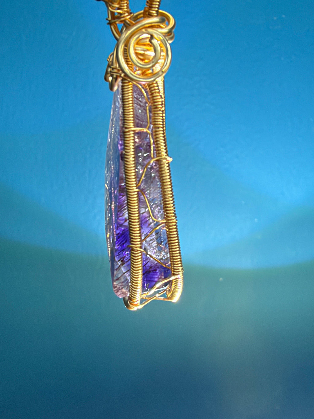 Super Seven Pendant - 12.3g Copper Wire Red Inclusion Crystal